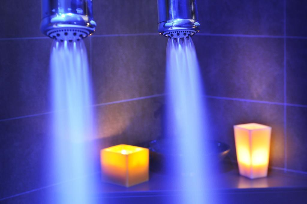 Sant Jordi Boutique Hotel Calella Exterior photo A shower with blue LED lighting