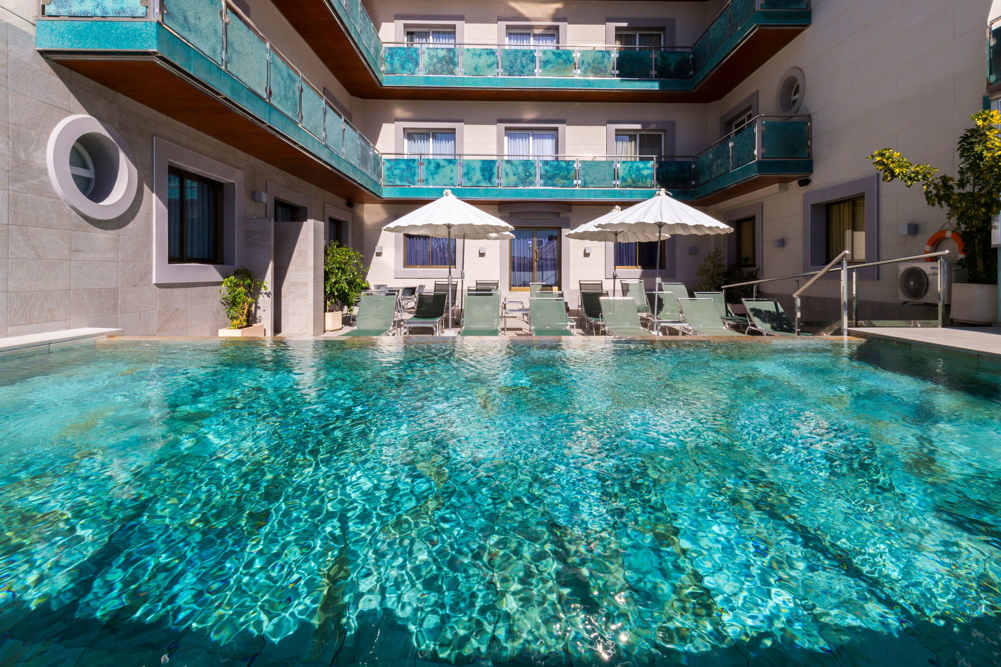 Sant Jordi Boutique Hotel Calella Exterior photo The pool at the hotel